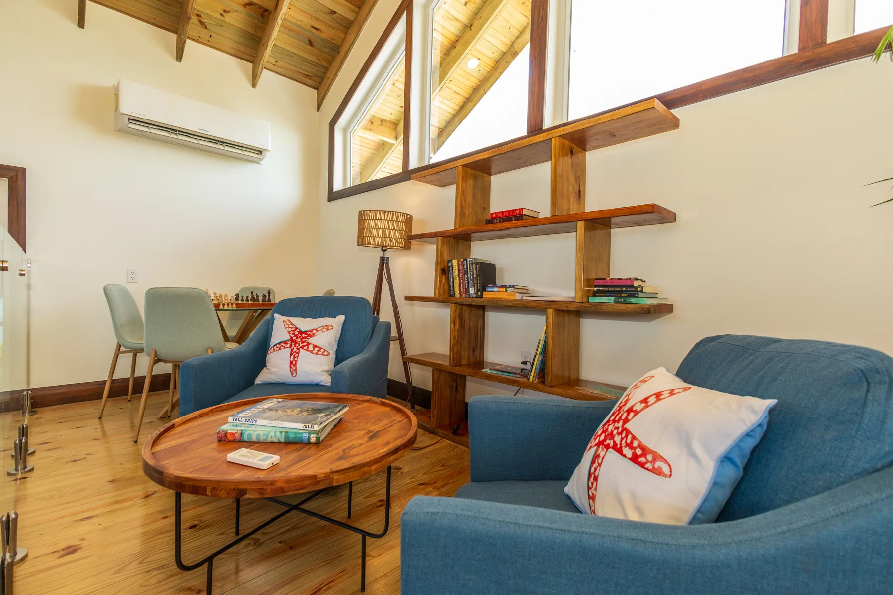 Loft seating and bookshelves beside the stair railing