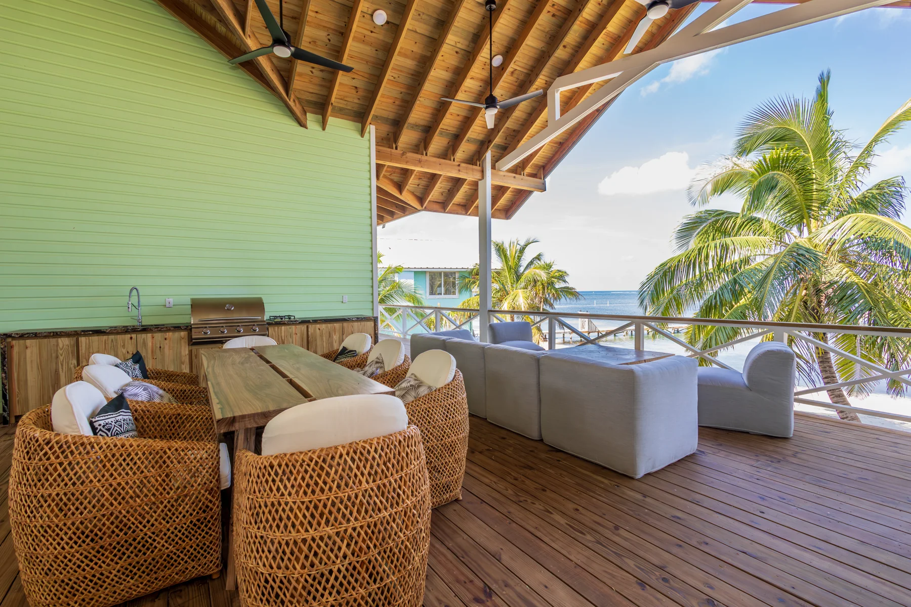 Covered porch seating facing the beach