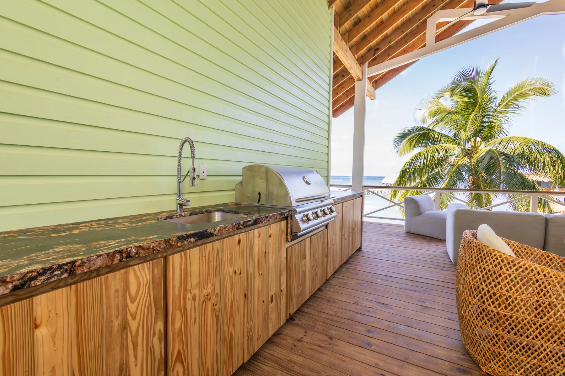 Outdoor kitchen counter and grill on the covered porch