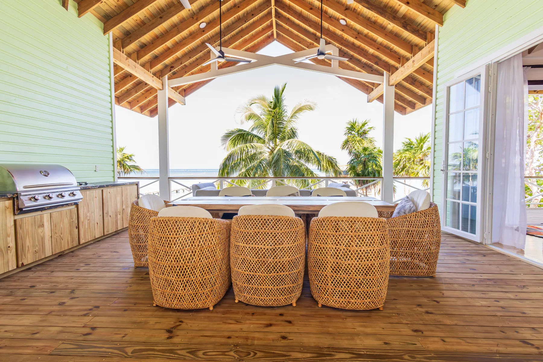 Outdoor dining table beneath the covered porch