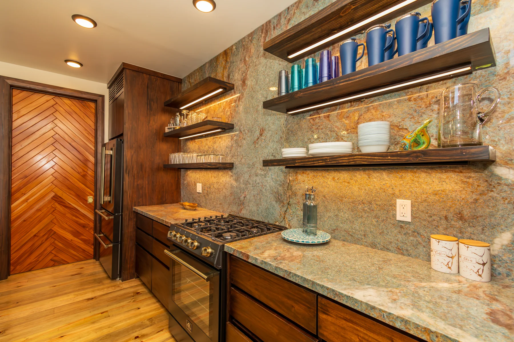 Kitchen stove, counters, and timber cabinetry